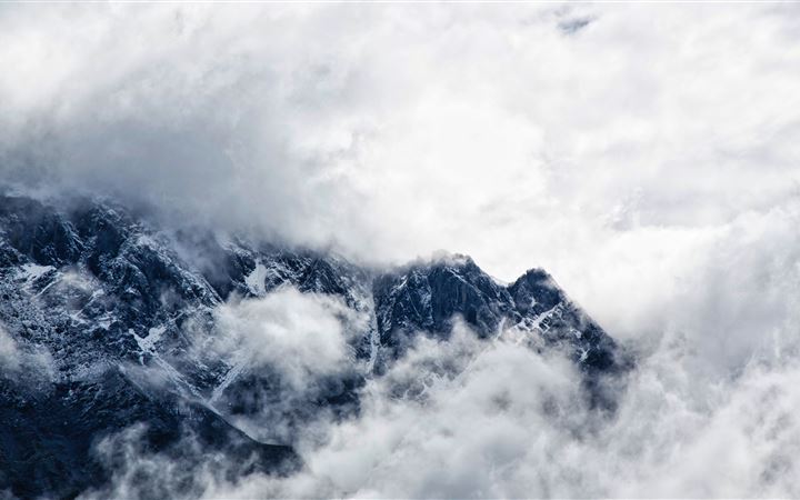 Clouds over the Caucasus Mountains All Mac wallpaper