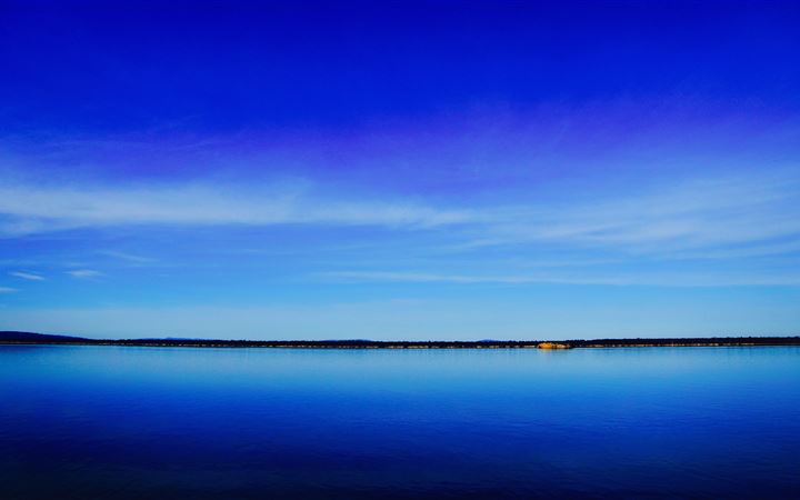 lake under blue sky MacBook Air wallpaper