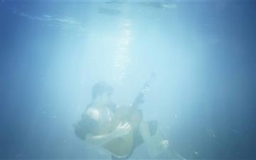 Playing Guitar Underwater MacBook Air wallpaper
