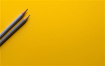 Minimal pencils on yellow iMac wallpaper