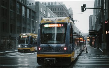 yellow and gray bus on st... MacBook Pro wallpaper