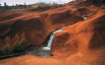 water flowing on brown hill All Mac wallpaper