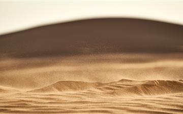 brown sand in closeup photography MacBook Air wallpaper