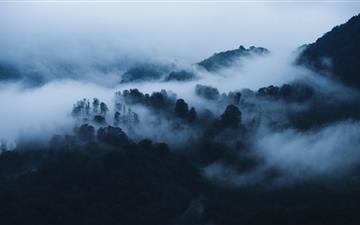 mountain covered with fogs iMac wallpaper