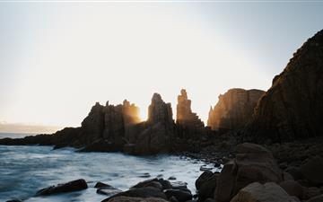 stone formations on ocean during daytime All Mac wallpaper