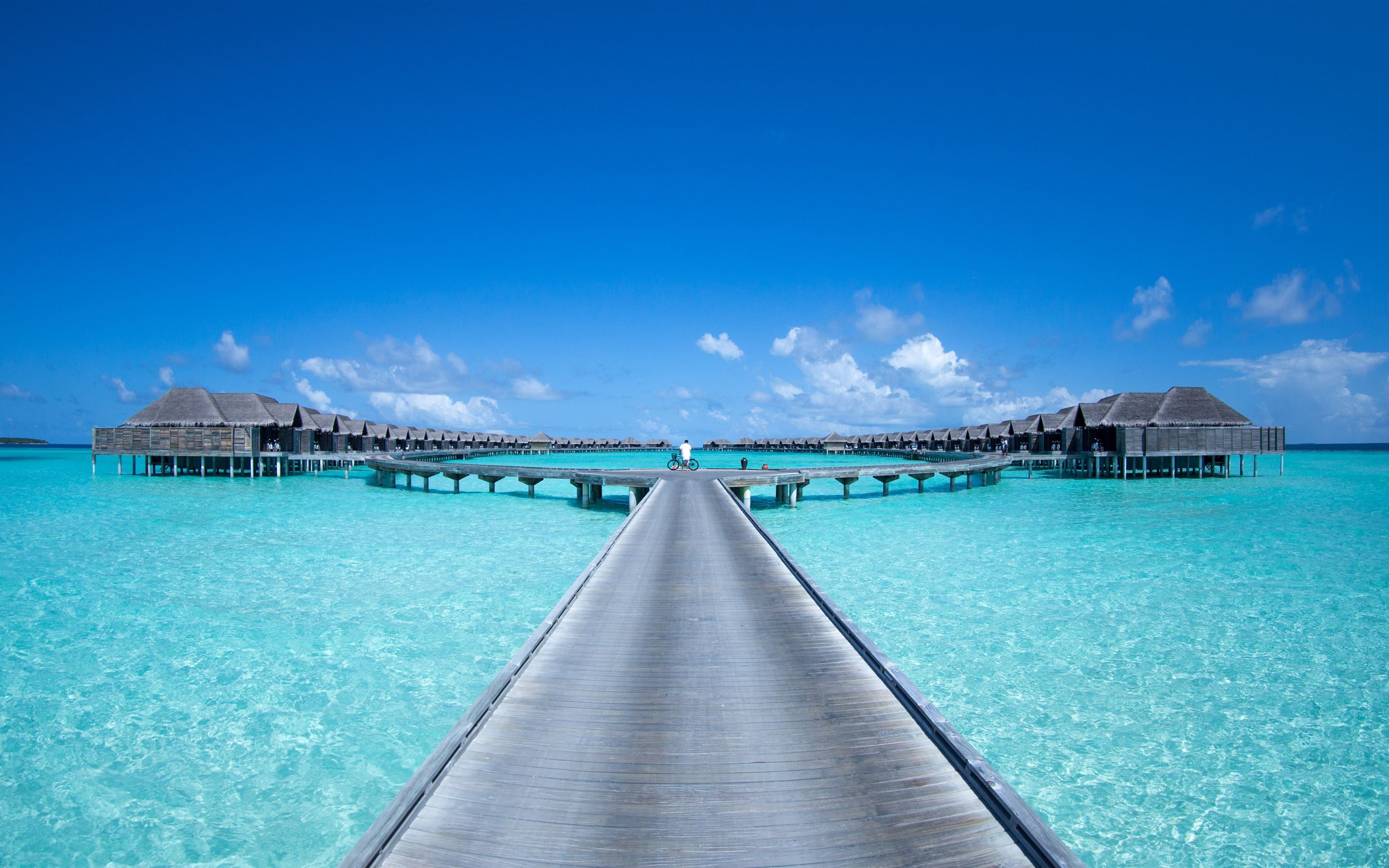 gray beach dock under blue skies MacBook Pro Wallpaper Download