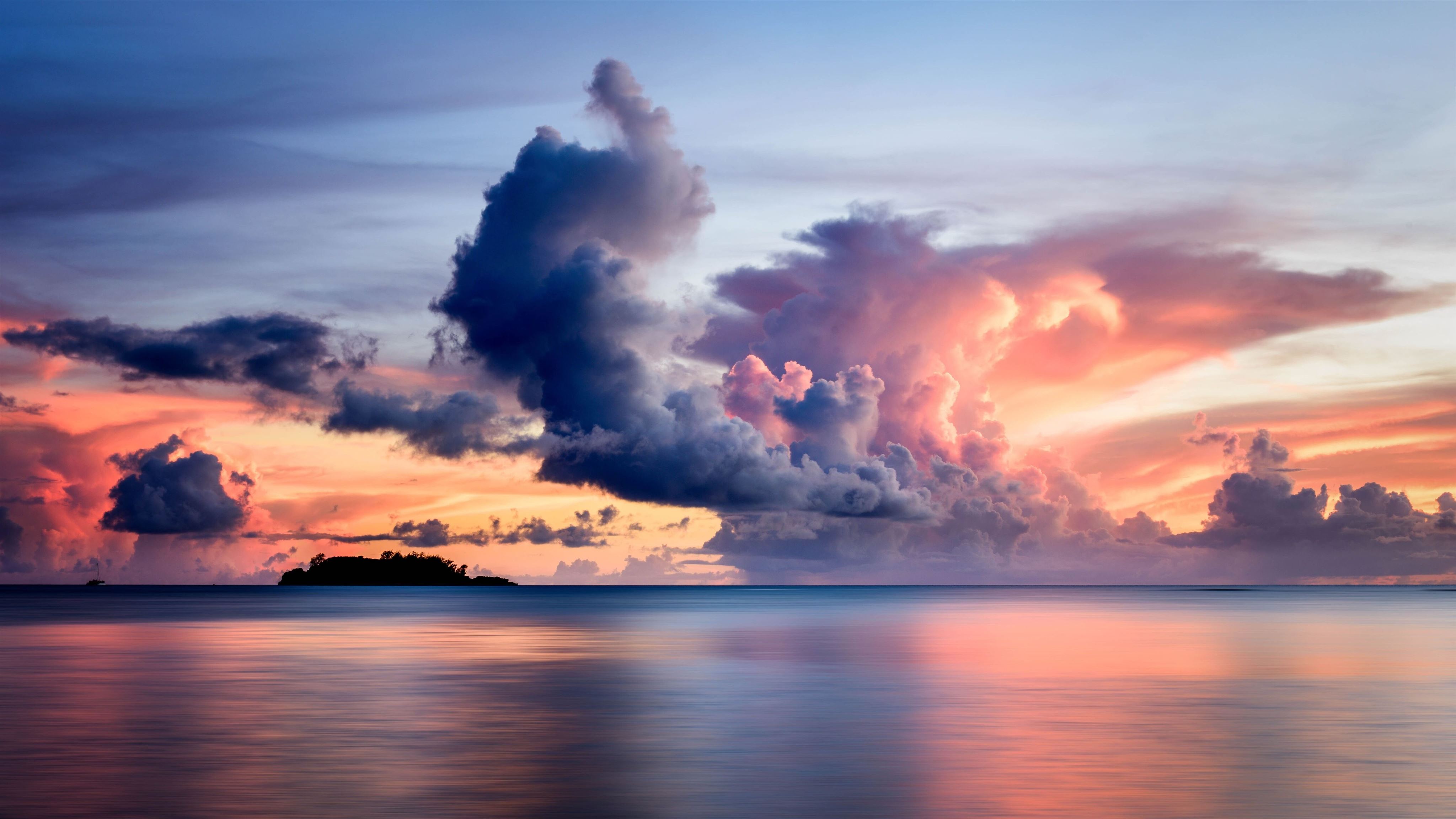 clouds over the sea 8k Mac Wallpaper Download | AllMacWallpaper