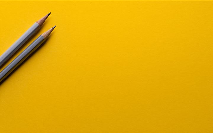 Minimal pencils on yellow iMac wallpaper