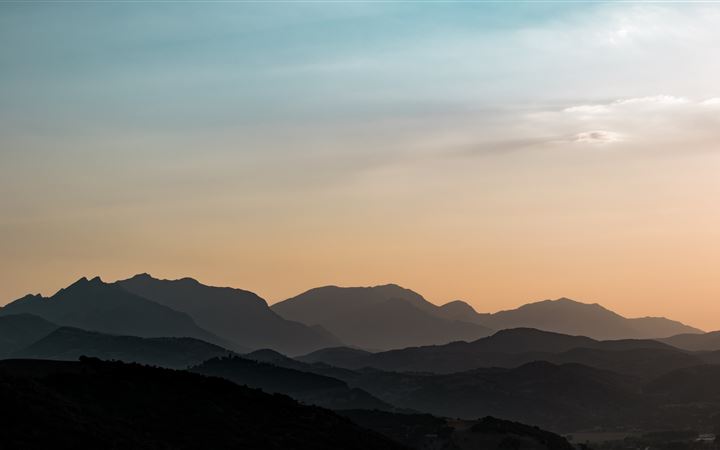 silhouette of mountain during golden hour iMac wallpaper