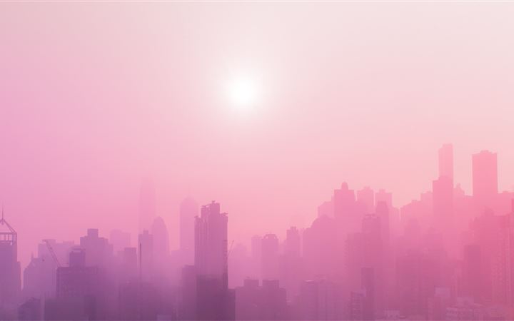 skyscraper covered with fog at daytime iMac wallpaper