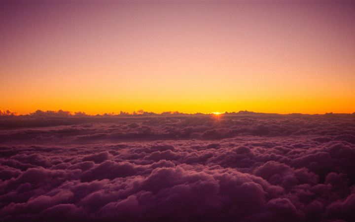 sun rises over the clouds from on top of mount fuj iMac wallpaper