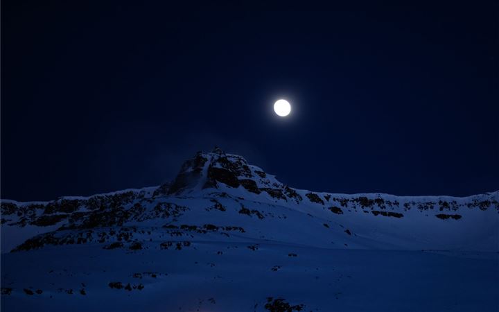 mountain covered with snow during night time All Mac wallpaper