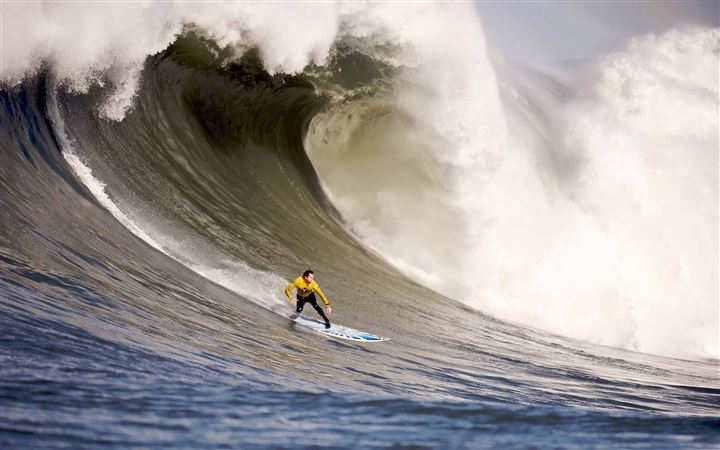 A Surfer Rides Down A Wave All Mac wallpaper