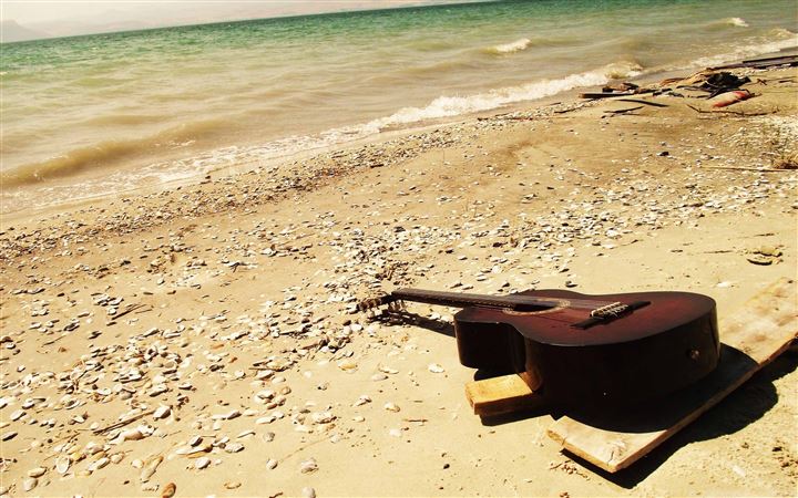 Guitar On The Beach MacBook Air wallpaper