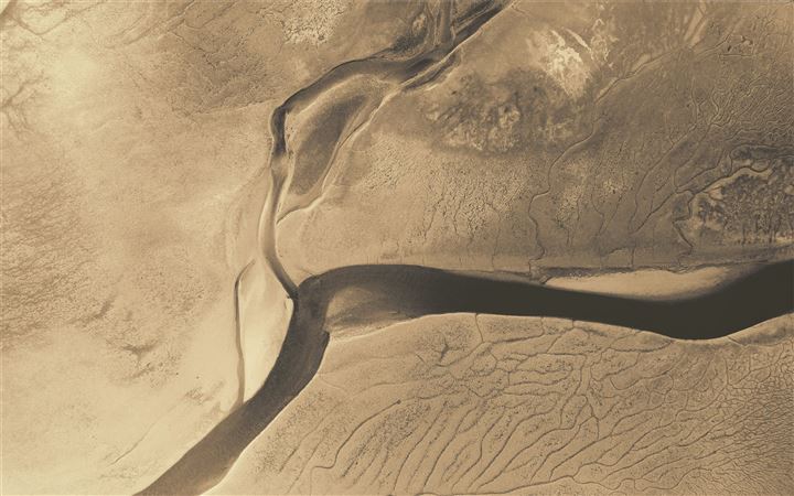River in an arid plain MacBook Air wallpaper
