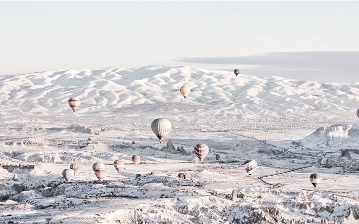 assorted color air balloons below snowland at dayt All Mac wallpaper