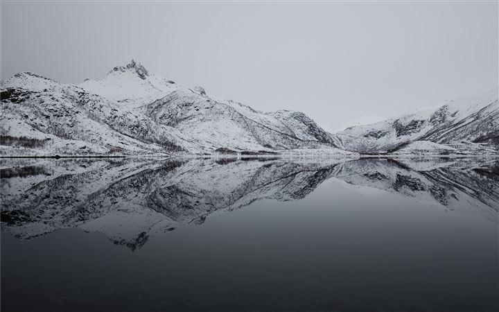 black and white mountain filled with snow near lak All Mac wallpaper