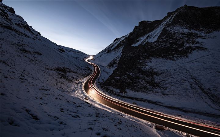 curvy road in middle of snow covered mountain All Mac wallpaper