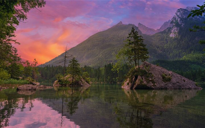 green trees near lake and mountain during sunset All Mac wallpaper