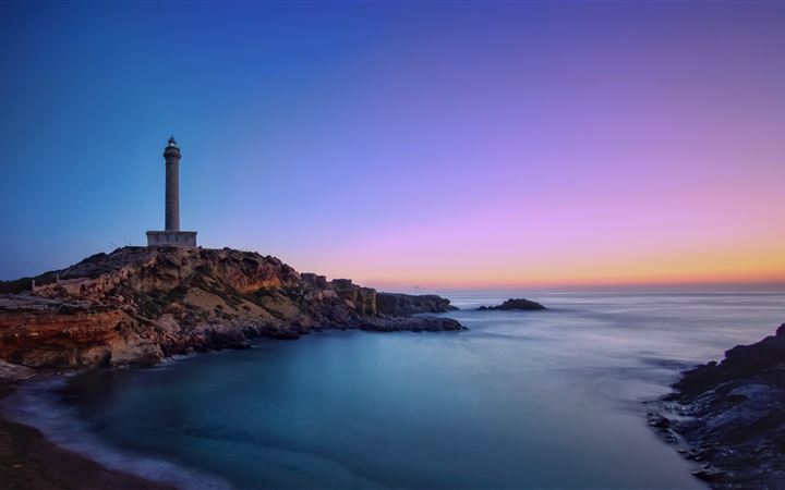 lighthouse rocks sea ocean 5k MacBook Air wallpaper