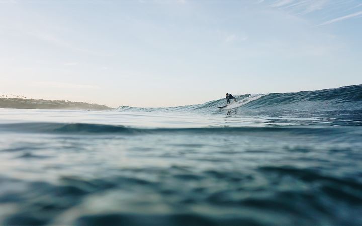 man surfing at sea All Mac wallpaper