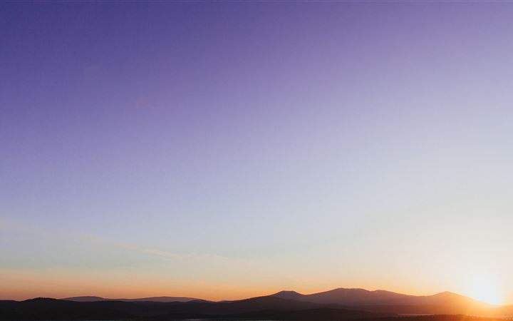 silhouette of mountains near body of water during All Mac wallpaper