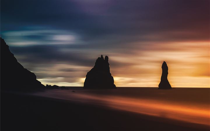 silhouette of rock formation during golden hour All Mac wallpaper