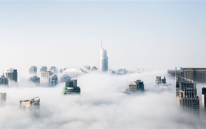 skyscraper buildings covered in fog All Mac wallpaper