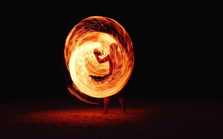 timelapse photography of person fire dancing MacBook Air wallpaper