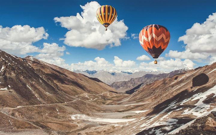 two hot air balloons floating All Mac wallpaper