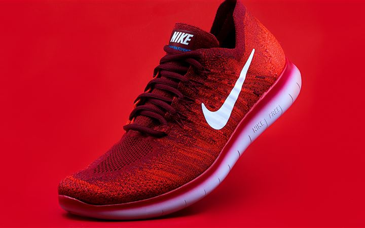unpaired red Nike sneaker MacBook Air wallpaper