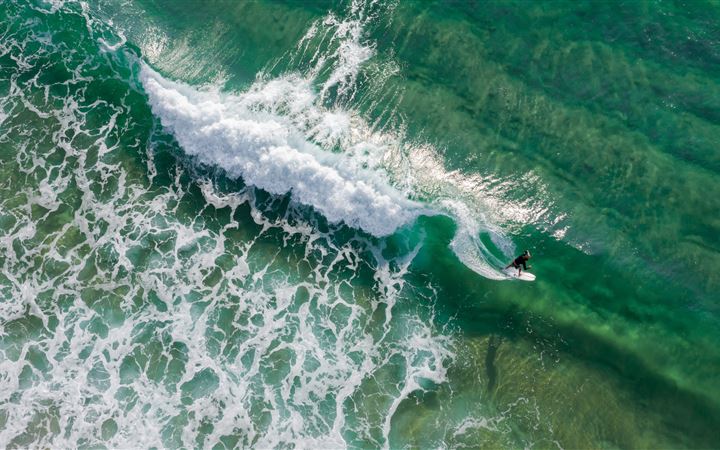 aerial photography of surfing person MacBook Pro wallpaper