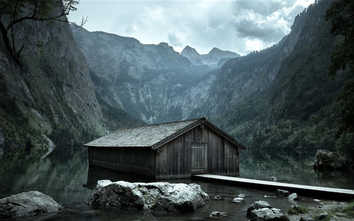 brown wooden cabin on body of water MacBook Pro wallpaper