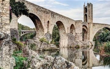 Besalus Romanesque Bridge MacBook Pro wallpaper