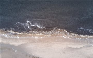 Sea washing ashore drone ... All Mac wallpaper