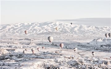 assorted color air balloons below snowland at dayt MacBook Air wallpaper
