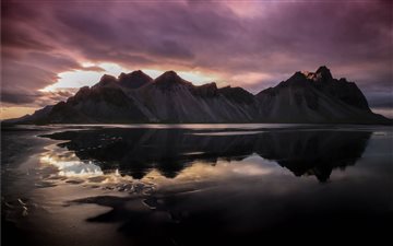 mountains reflecting on body of water All Mac wallpaper