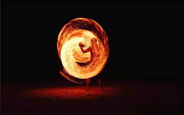 timelapse photography of person fire dancing All Mac wallpaper