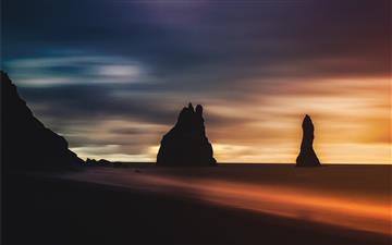 silhouette of rock formation during golden hour All Mac wallpaper
