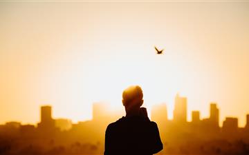 silhouette photography of person during sunrise MacBook Pro wallpaper