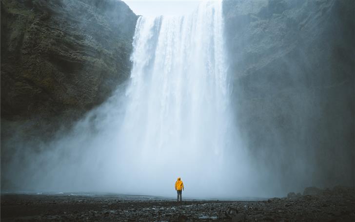 person standing near waterfalls Mac Wallpaper