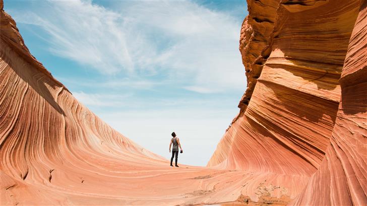man on antelope canyon during daytime Mac Wallpaper