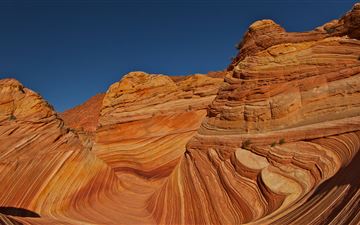 brown rock formation under blue sky during daytime All Mac wallpaper