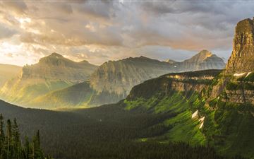 stormy sunrise at glacier national park 8k iMac wallpaper