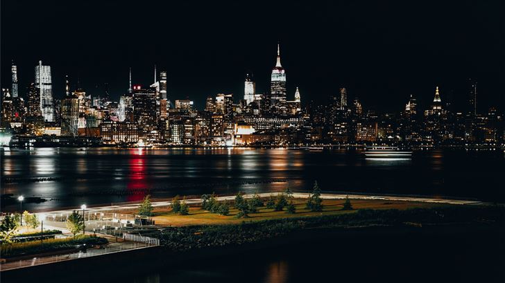 city skyline during night time Mac Wallpaper