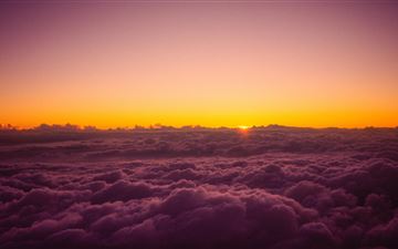 sun rises over the clouds from on top of mount fuj iMac wallpaper