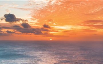 sunset at edge of ocean 5k iMac wallpaper