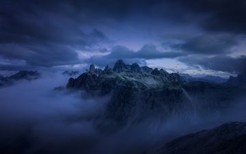 mountains cliff covered under fog mist 5k MacBook Air wallpaper