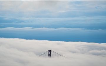 aerial view of bridge under clouds 8k iMac wallpaper