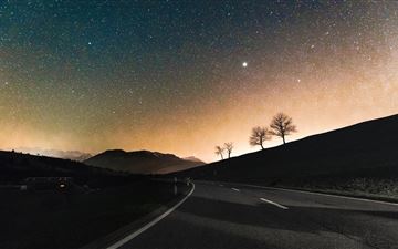 sky full of stars road down to hill 8k MacBook Pro wallpaper